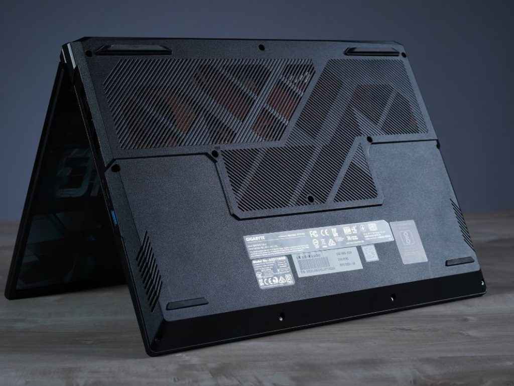 Gigabyte G6X 9MG Review: Laptop's underside showcasing multiple vents