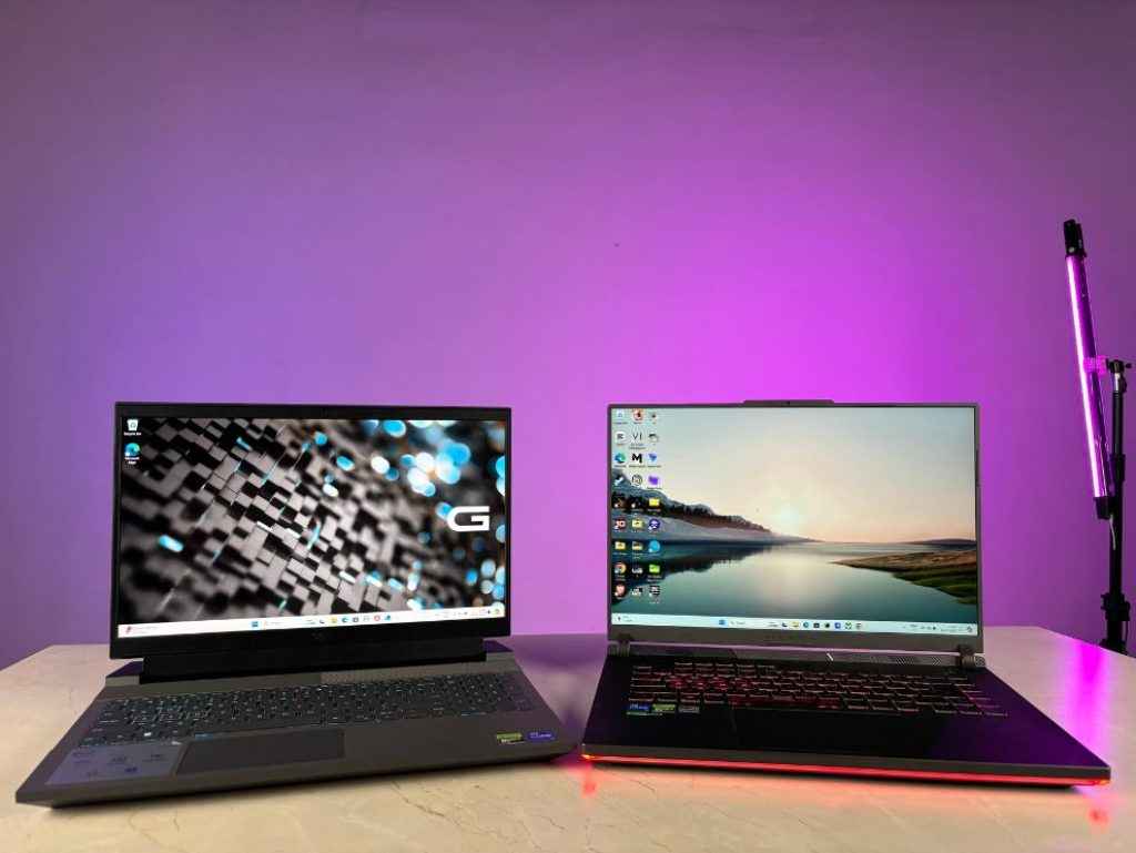 Dell G15 Vs ASUS Strix G16 Comparison Review: Laptops Sitting with their screens facing the camera