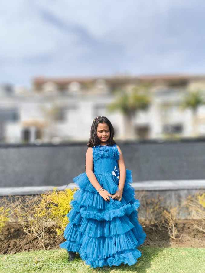 Nothing Phone (2a) Camera Review - a well-lit photo photo of a young girl in a blue dress taken in the morning or late afternoon