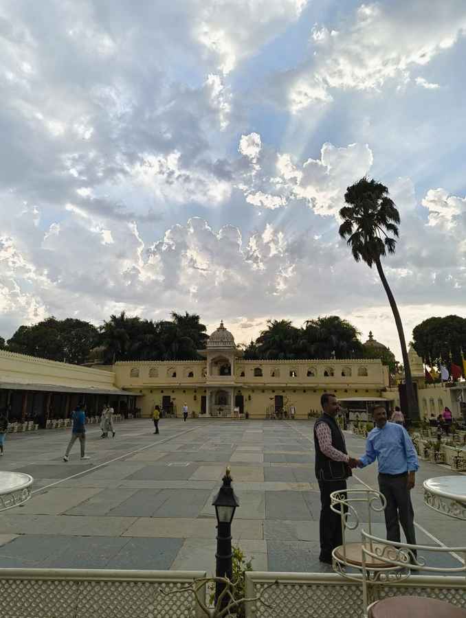 Nothing Phone (2a) Camera Review - a daylight photo of an Udaipur palace courtyard with some people