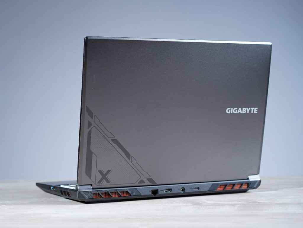 Gigabyte G6X 9MG Review: Laptop sitting sideways while its back is visible showcasing its lid