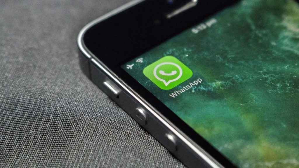 Phone screen displaying WhatsApp icon