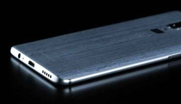 OnePlus 6 leaked image tips at vertically stacked dual cameras, wooden finish