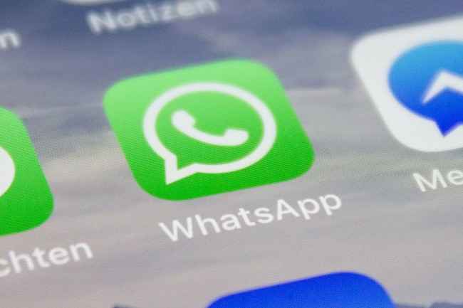 How does WhatsApp track these violations?
