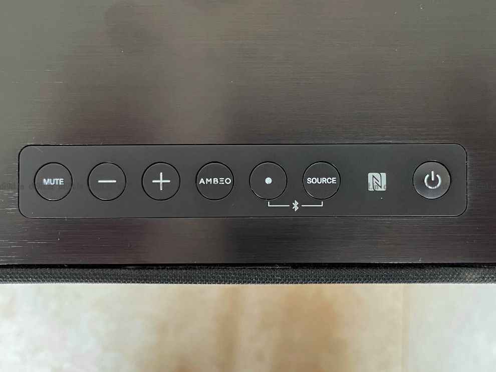 The soundbar has physical controls on the top.