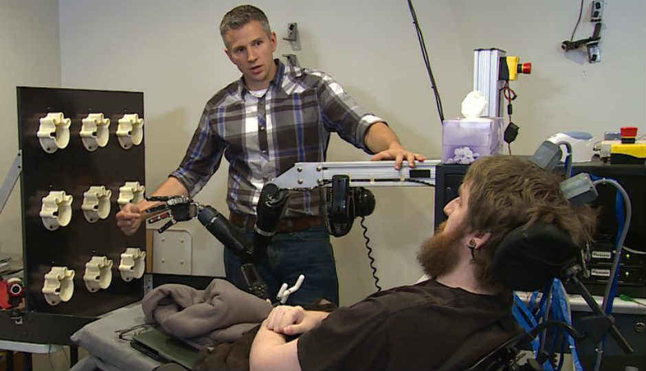 Chips embedded in brain allow man to feel touch through robotic arm