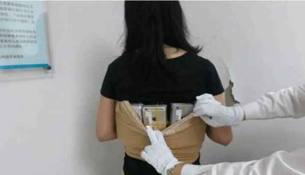 A woman tried to smuggle 102 iPhones strapped to her body
