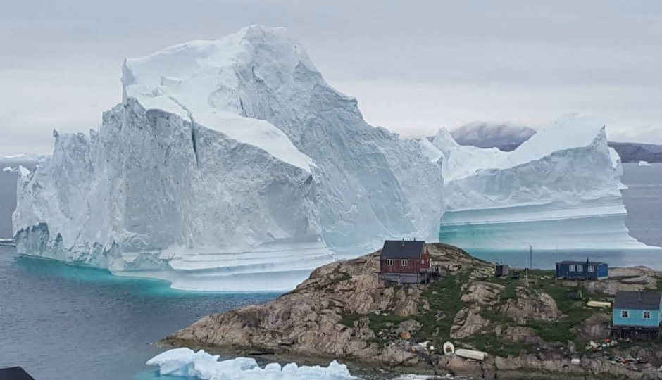 11 million ton iceberg inching towards Greenland village, can be seen from space