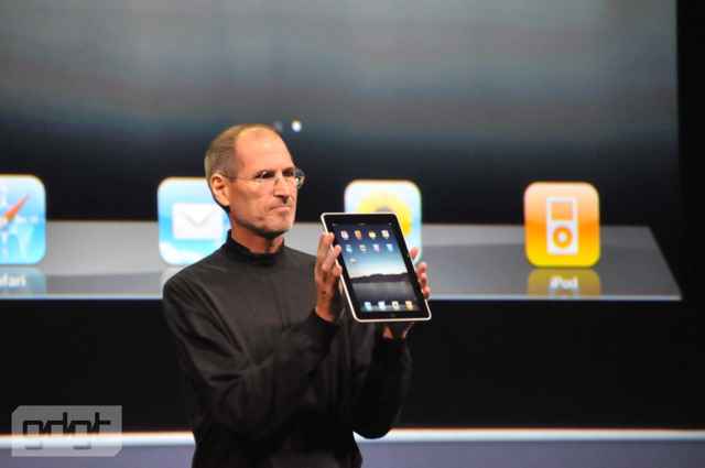 Steve Jobs displays the Apple iPad