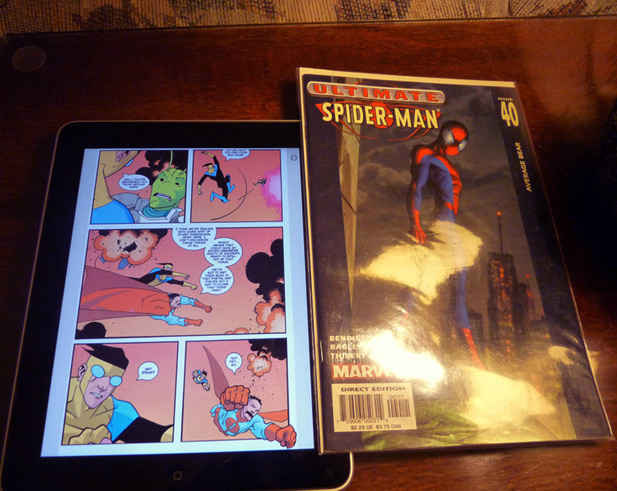 The Apple iPad displaying a comic next to a comic book